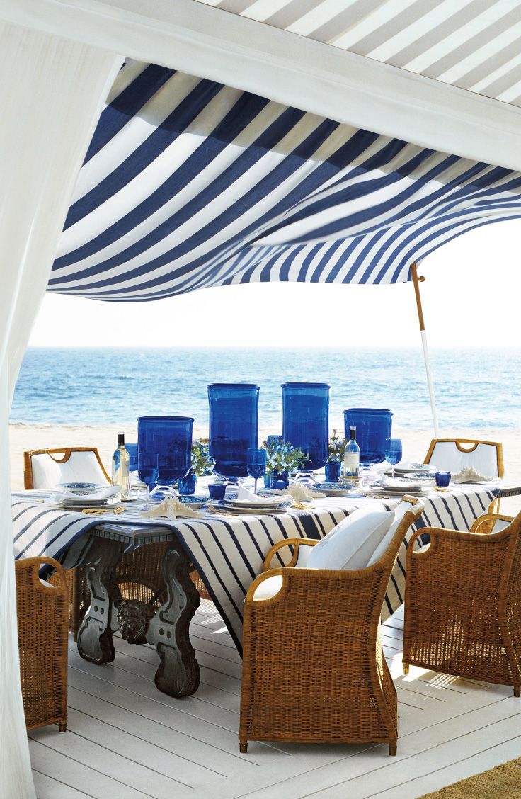 Beach side patio with striped awning