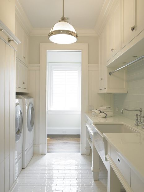 Clean Laundry Room with White Cabinets