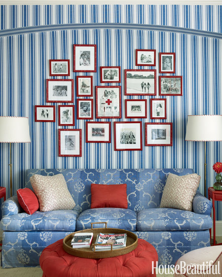 Gallery Wall with red flames and blue wallpaper via HB