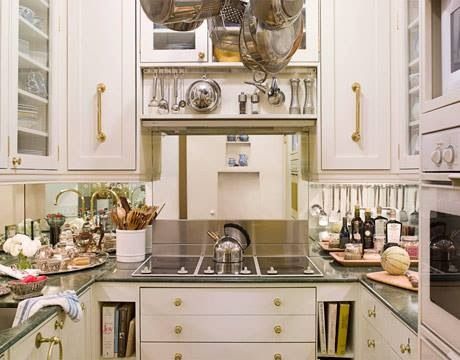 Mirrored Backsplash makes this kitchen feel better