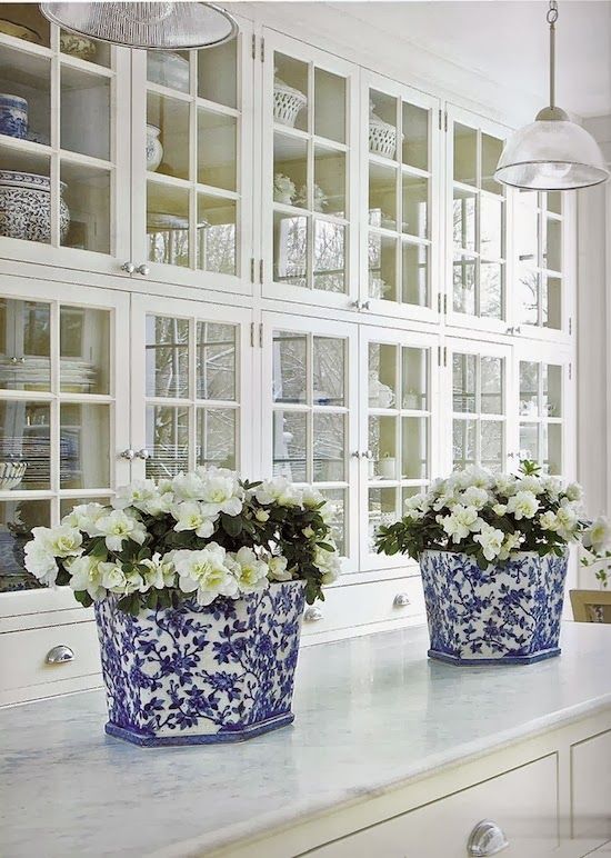 white kitchen with blue and white vases