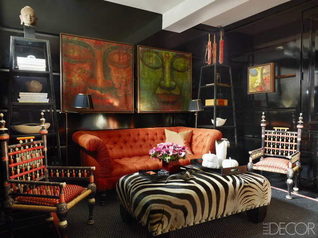 Black lacquered walls with zebra upholstered ottoman