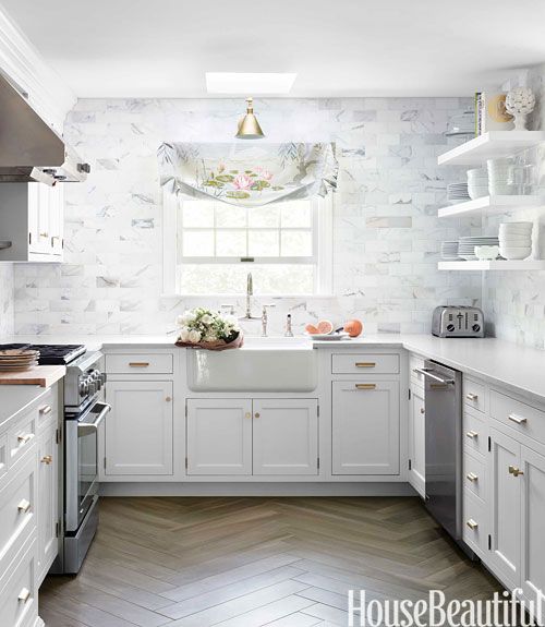 Caitline Wilson created this stunning kitchen with herringbone hardwood via House Beautiful