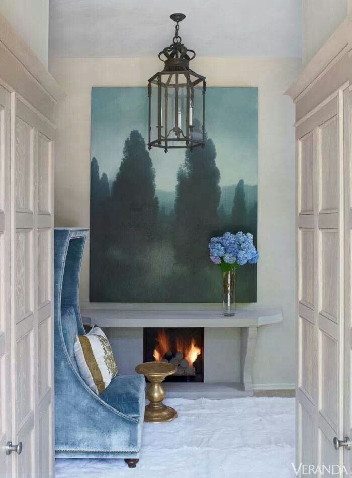 Small fireplace in a nook featured in Veranda