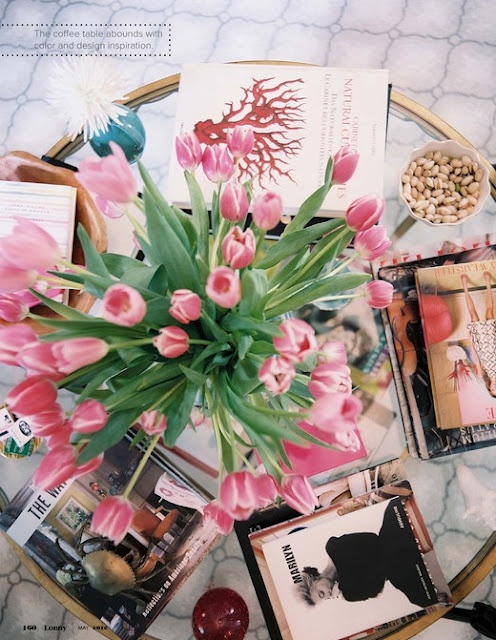 Coffee table of pink tulips via Lonny