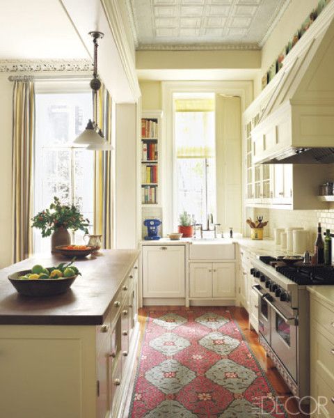 Kitchen with a chic rug designed by Sheila Bridges