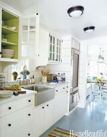 Light kitchen with glass fridge via House Beautiful