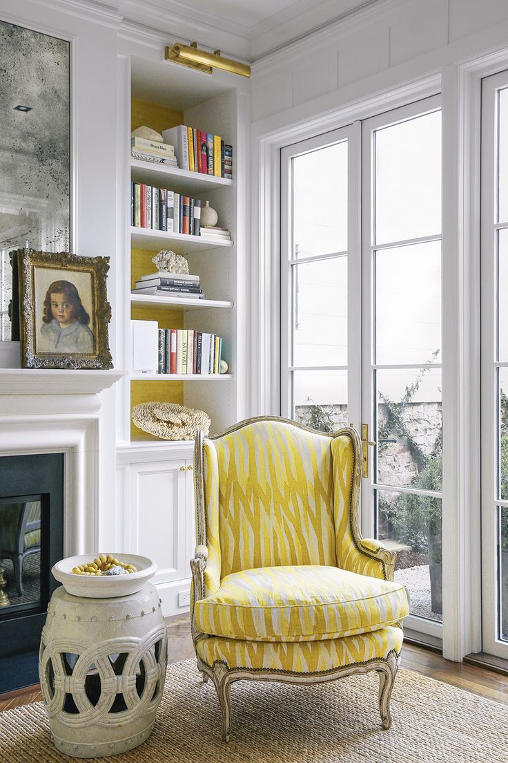 Yellow chair in a corner via Susan Greenleaf via Lonny
