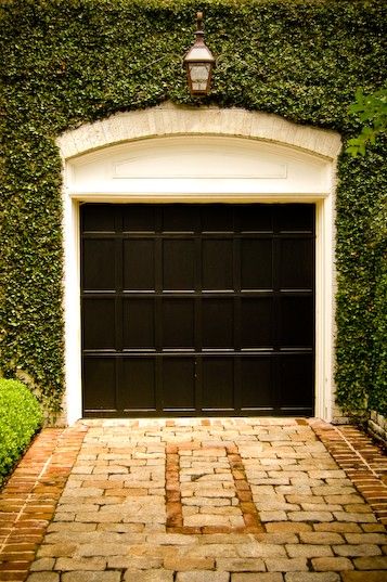 Perfect black garage with trimmed ivy  via High Street Market