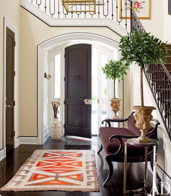 Accents of orange in this entry runner via AD