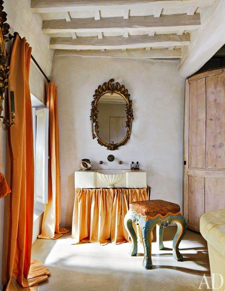 dusty orange curtains and apricot skirted sink via AD