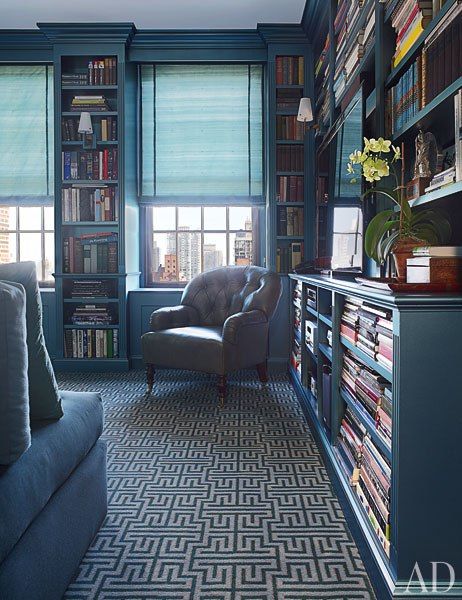 Blue aneled library with roman shades via AD