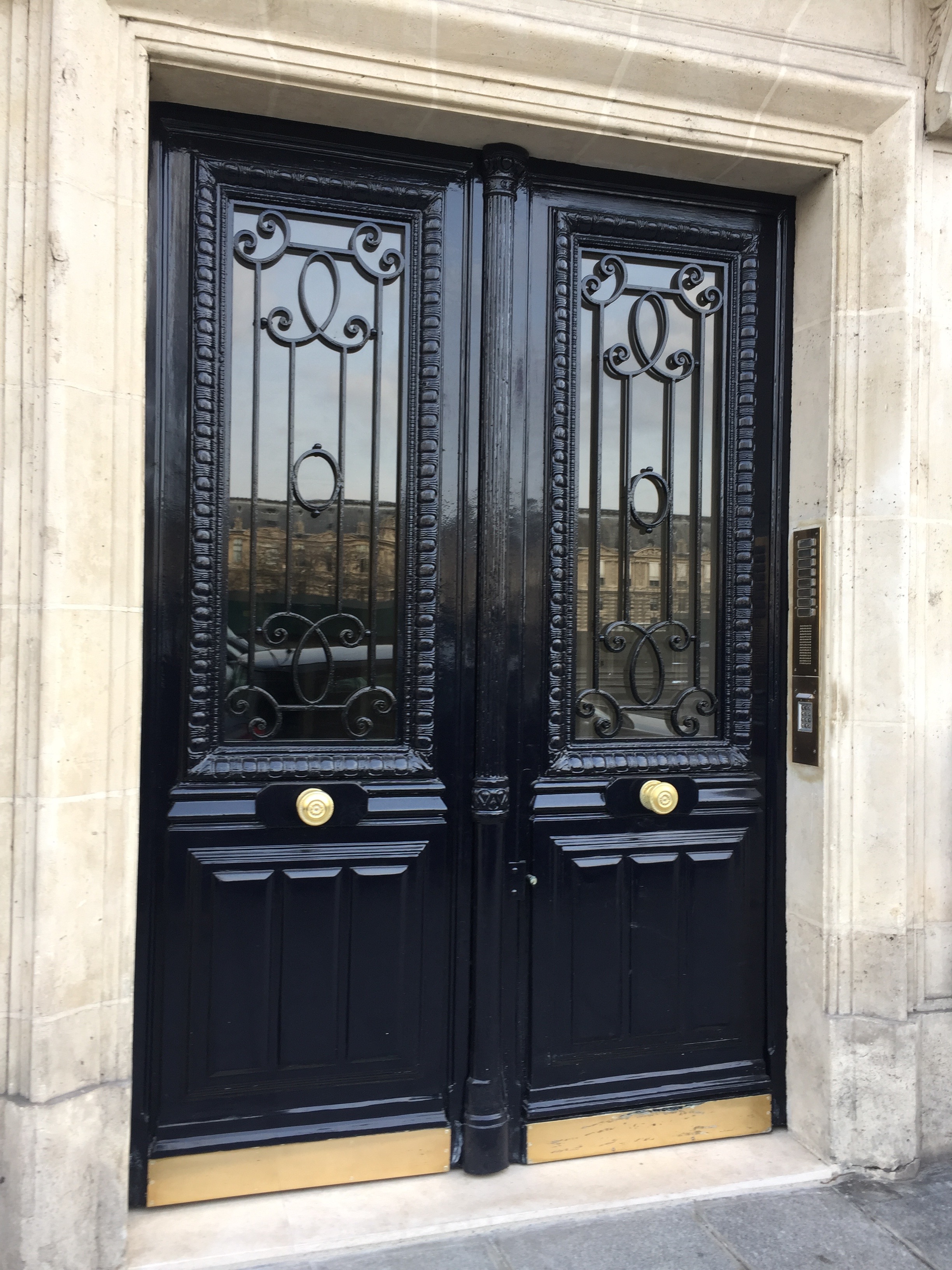 Black Doors in Paris photo by Christina Dandar for The Potted Boxwood