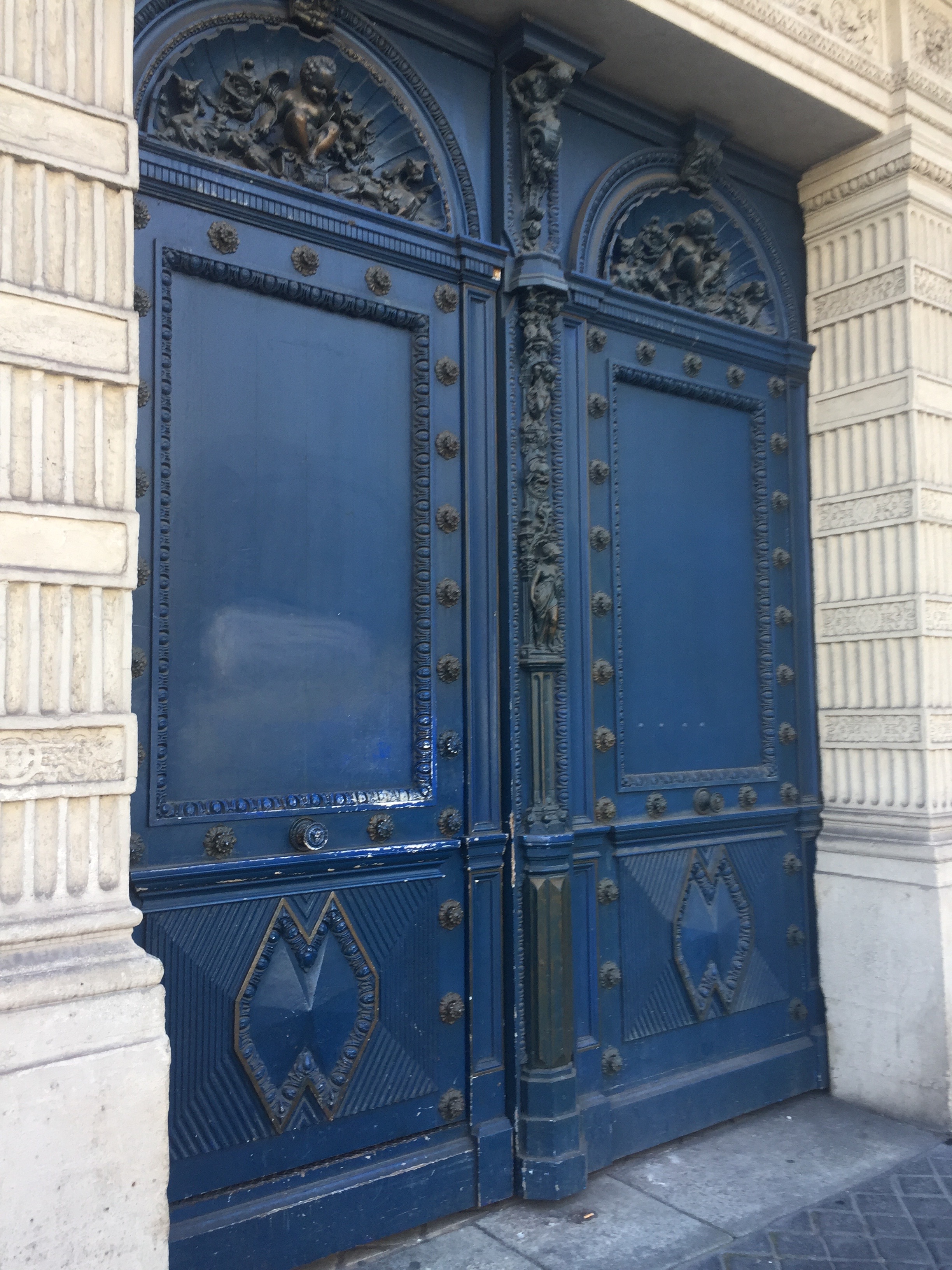 Blue doors in Paris photo by Christina Dandar for The Potted Boxwood
