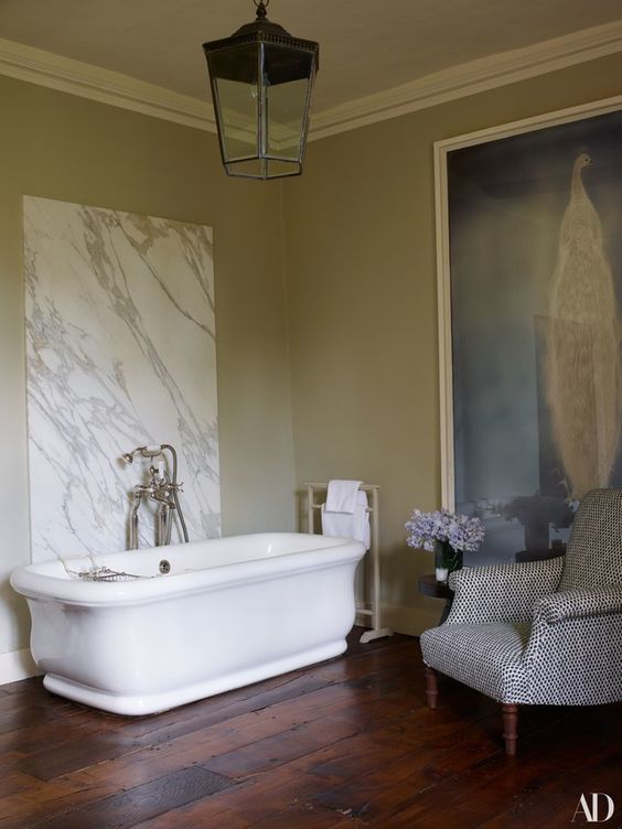 Bathtub with marble wall via AD